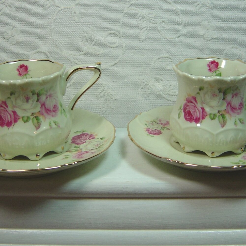 2 NEW matching tea cup & saucer sets-ivory with pink roses
